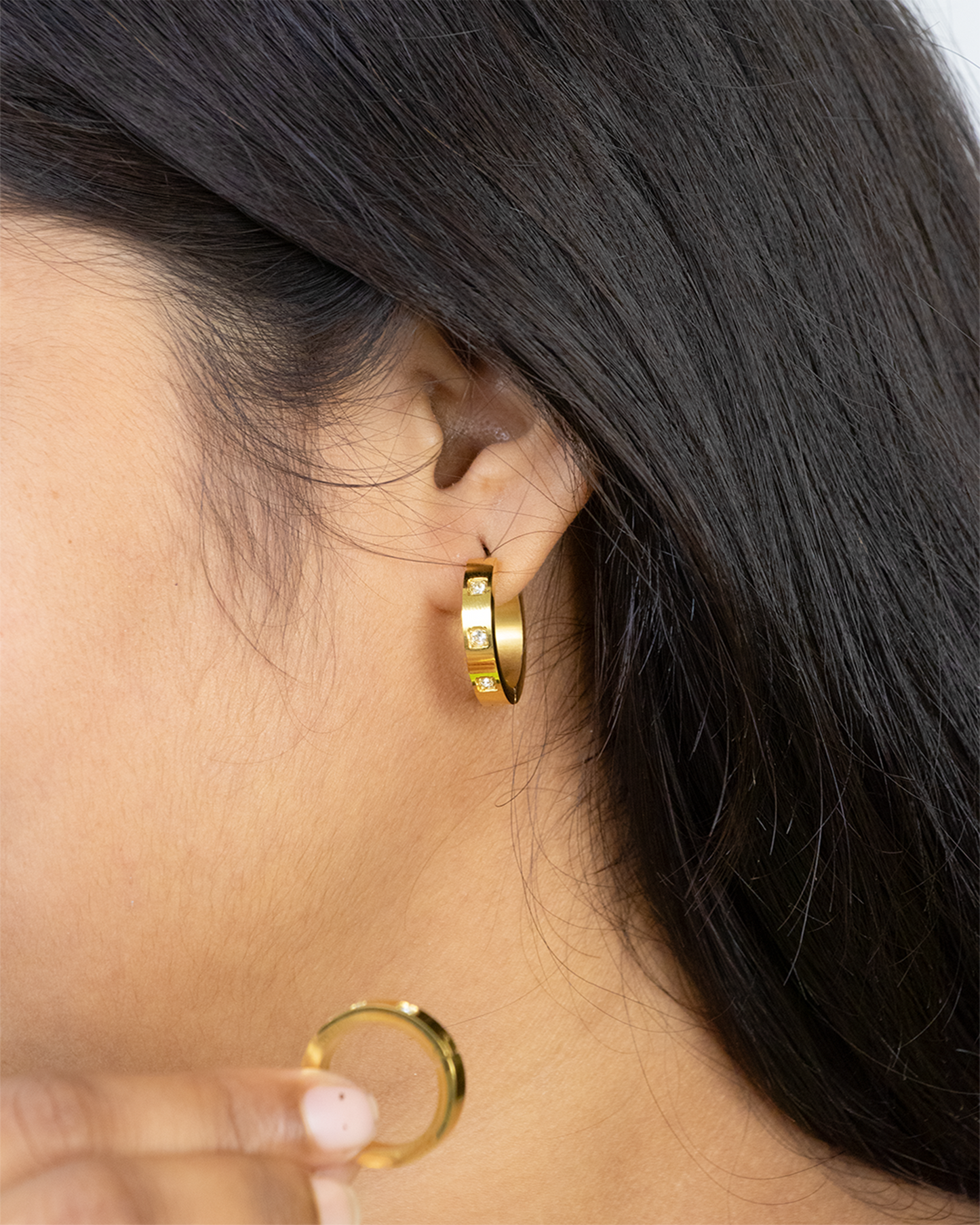  gold hoop earrings with small Diamonds